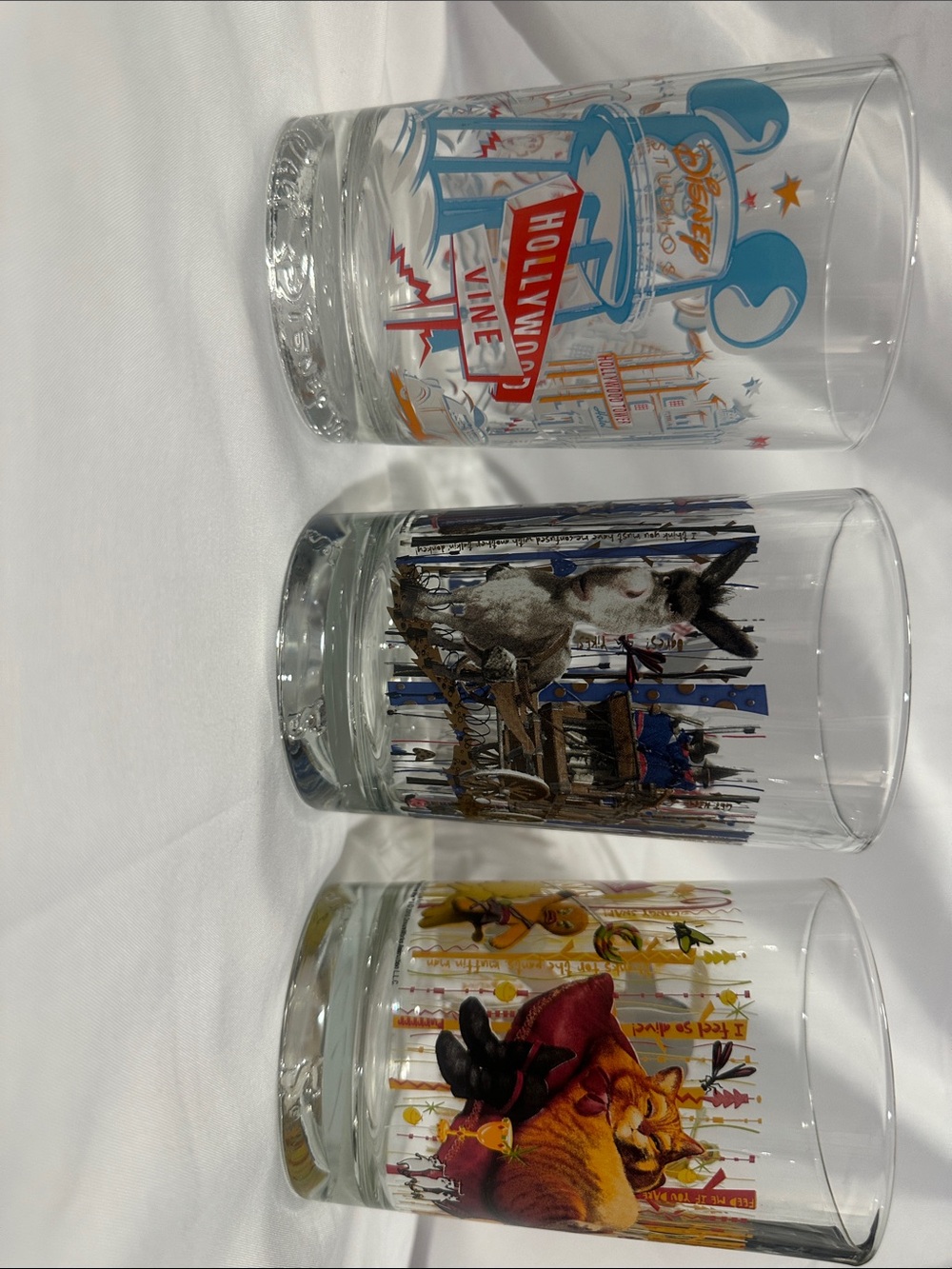 McDonald's Clear Glass Tumblers with Blue, Brown, Yellow Artwork
